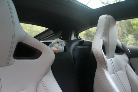 The most convenient storage bin I’ve ever seen in a coupe: a cubby for small items between the seats. Photo credit: Stef Schrader